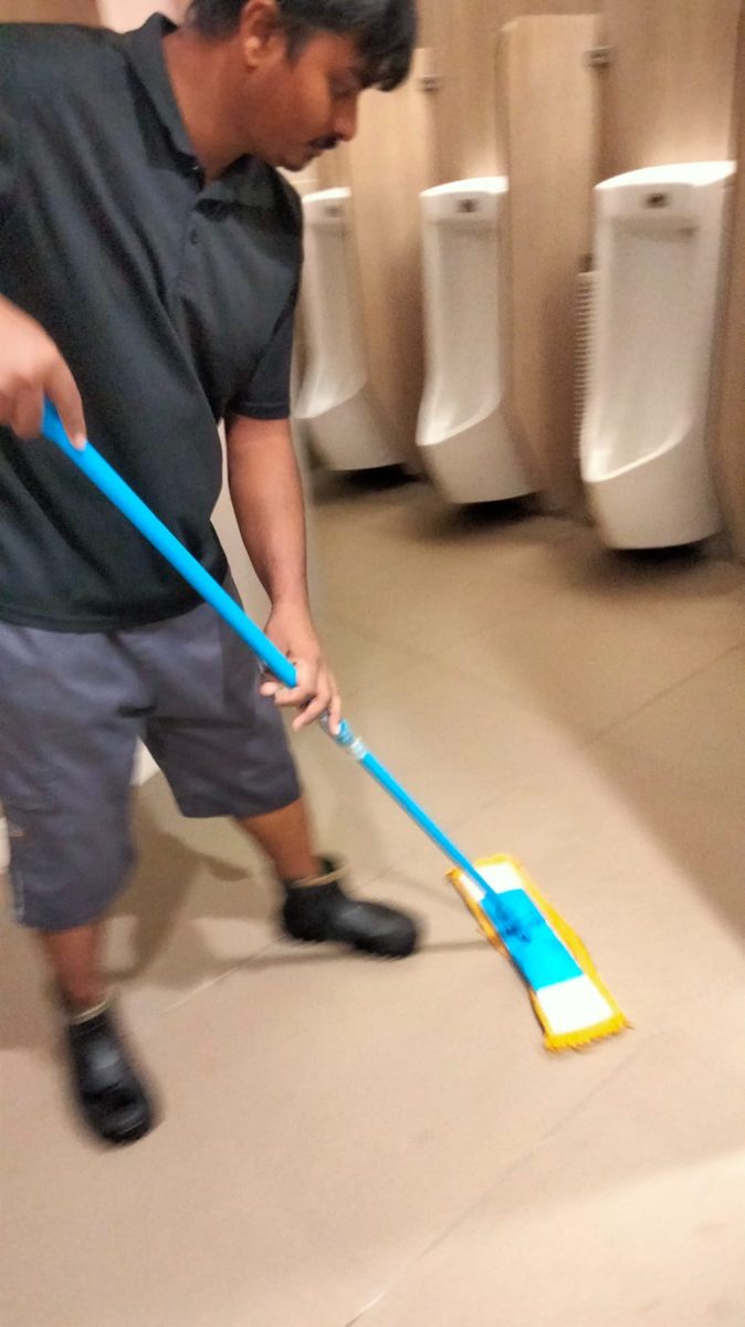 Mopping washroom floor